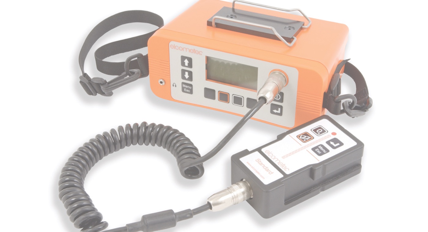 An Elcometer holiday detector with shoulder strap and separate control unit