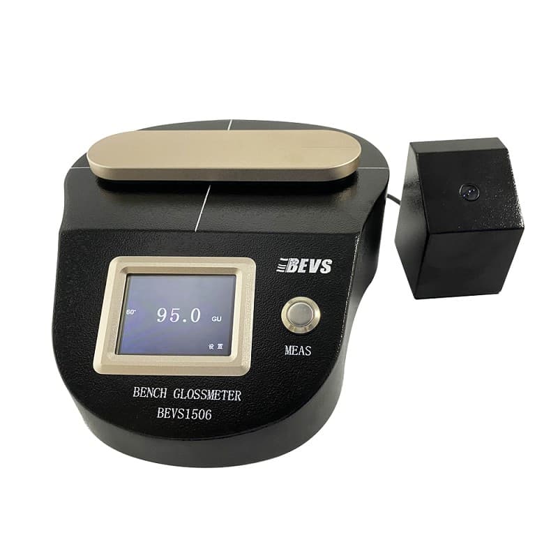BEVS 1506 Bench Glossmeter, a black benchtop gloss meter with touchscreen and separate optical sensor switch