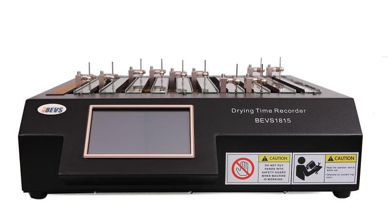 BEVS 1815 Drying Time Recorder, a black bench instrument with ten stylus tracks across glass strips and a touchscreen on the front panel